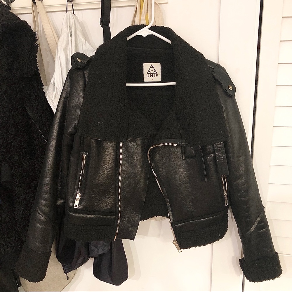 Black Sherpa lined jacket with glossy exterior.